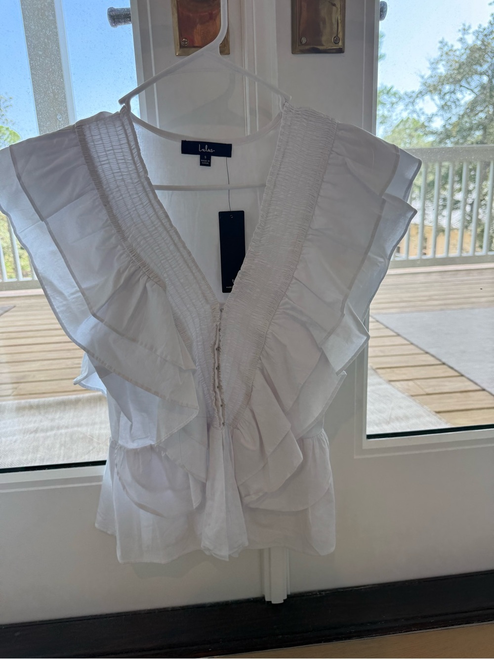 Lulu's White Ruffle V-Neck Sleeveless Top
